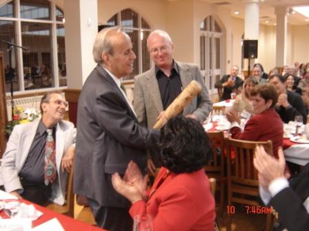  Bill Ryan presents his special maple wood bat to Ricardo Alarcon, president of the Cuban parliament.