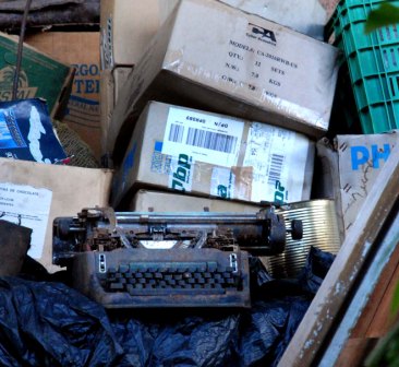 An Underwood typewriter in the trash.