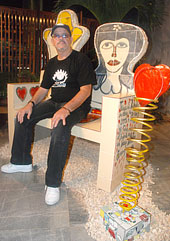 Fuster sitting on his "bench of love"