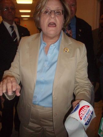 Rep. Ileana Ros-Lehtinen hurls accusations Thursday against those opposing the travel ban while holding her enemies’ stickers in her hand.   