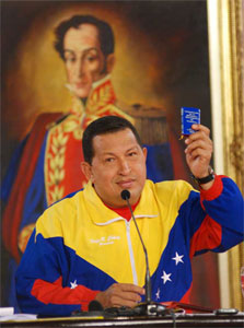 President Hugo Chavez holding up the Venezuelan constitution. Photo: Caridad