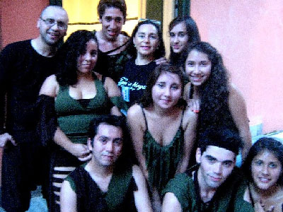 The entire dance company, with director Cyntia Moya at the center. 