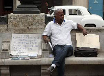 Real Estate activity becomes a legal activity in Cuba. The photo is of a "runner" on Havana's Prado promenade.