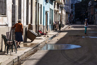 After the flooding, residents dry out their possessions.  Photo: Juan Suarez