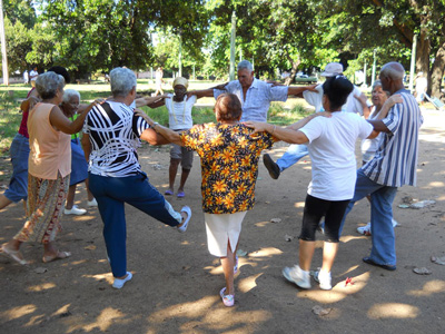 Elderly improve their conditions with outdoor exercise in front of the rehabilitation center.
