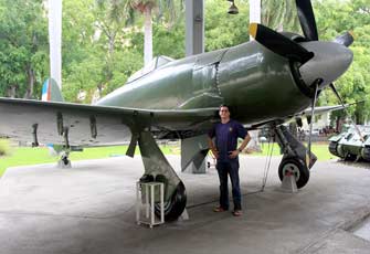 The author next to the plane piloted by his father, on display at Havana’s Revolution Museum.