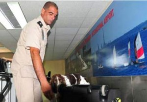 Customs official inspects luggage at Havana’s Jose Marti International Airport.