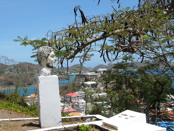 Bust of Maurice Bishop in Upper Cemetery; Fort George, where he was killed, in the background.  Photo: Shalini Puri