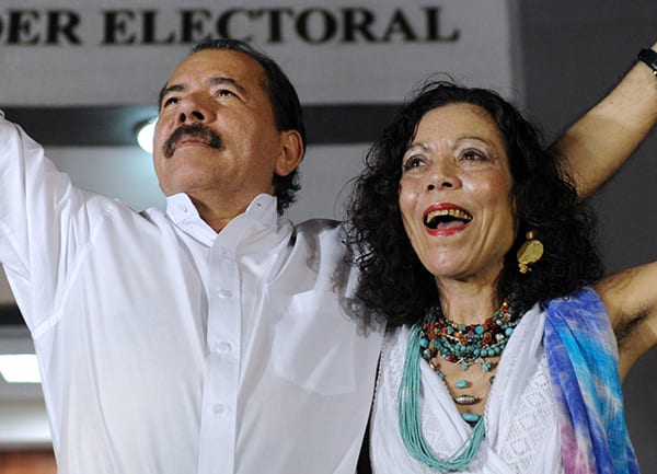 Nicaraguan President Daniel Ortega (L) celebrates with First Lady Rosario Murillo after receiving the credentials in Managua on January 9, 2012, a day before his re-inauguration. AFP PHOTO/Rodrigo ARANGUA (Photo credit should read RODRIGO ARANGUA/AFP/Getty Images)