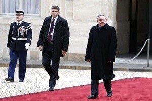 Raul Castro, tailed by his grandson and bodyguard during an official ceremony in Paris.
