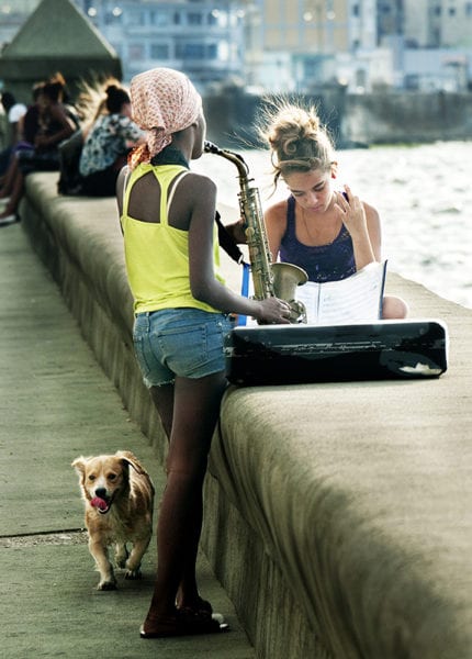 Music students on Havana's Malecon seawall. Photo: Ilia Khodos