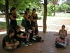 Young people in the park who joined in to listen to Marta\'s experiences with 15-M: