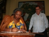 Angolan culture minister signs the Casa de Africa guest book.