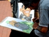 Artist Hugo Chirino drew caricatures of Barack Obama and Fidel Castro