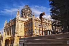 Scaffolding on the Corona, a hotel under construction located next to Revolution Palace.
