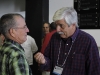 Carlos Borroto, right, of the Havana Biotech and Genetic Engineering Center, talks with a delegate at the closing of the Party Congress.  Photo: Jorge Luis Baños
