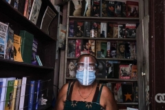 Felicia wearing PPE because of COVID-19 at her second-hand bookstore.