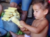 Even the youngest in the house who want to eat hayaca help to shuck the corn.