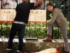 Young Venezuelans from the “Ciudad Compartida” (Shared city) project hang their photos in public places.