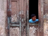 Boy looking out from a door, Havana.  Photo by James NG