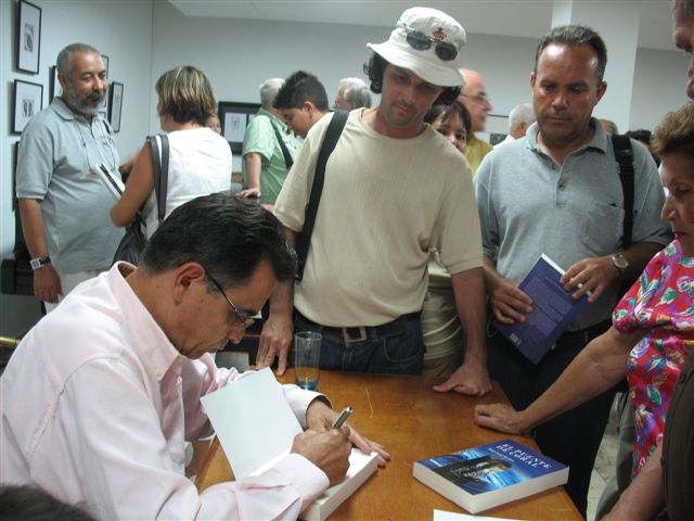 Hugo Luis Sanchez signing his new book The Coral Bridge.