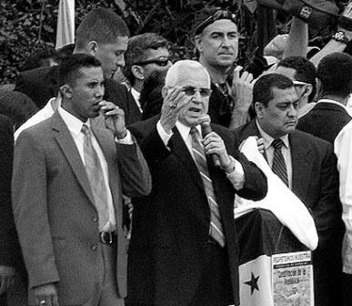 Roberto Micheletti, center, the defiant de-facto president of Honduras.