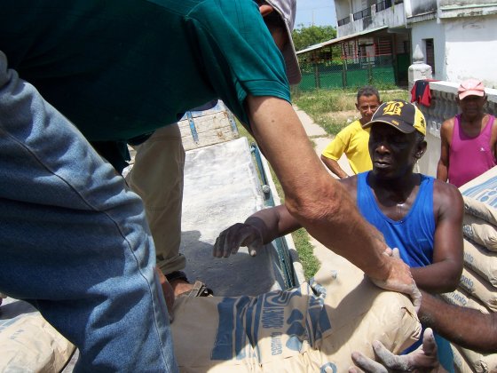 Unloading cement for housing repair.