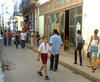 The police officer mentioned in this post is on the right and blind beggar is the man in the street next to the boy with his back turned.