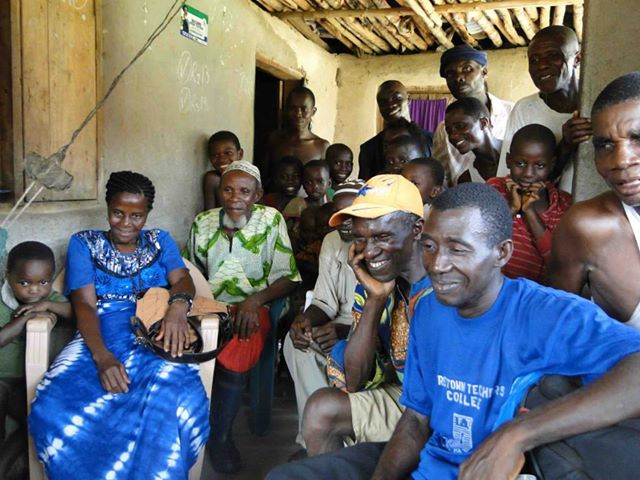 Members of the community of Mokpangumba, Upper Banta, Sierra Leone watch parts of the film premiered recently in Cuba. 