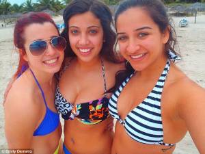 Emily Demello (right) next to her friends during a trip to Cuba at the end of 2011. This is one of the photos rescued by the Cuban scuba diver.