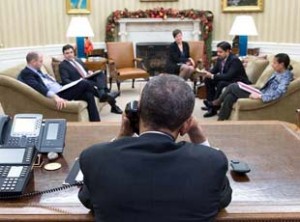 President Barack Obama in the Oval Office, during a historical phone conversation with Raul Castro on December 16.