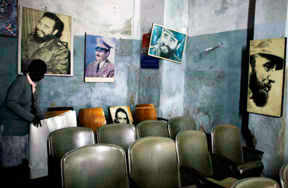 Pictures of Fidel and Raul Castro in a rundown Havana locale.