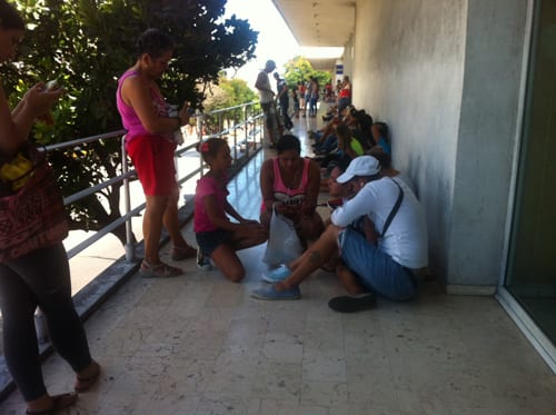 People at one of the Wi-Fi points on La Rampa. 