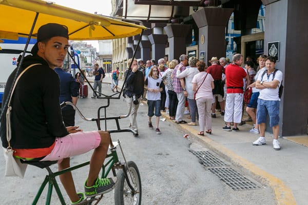 Bicycle taxi at the entrance to a hotel in Havana. Photo: Juan Suarez