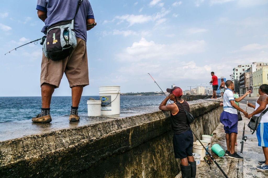 Fishing on the Malecon seawall. Photo: Juan Suarez