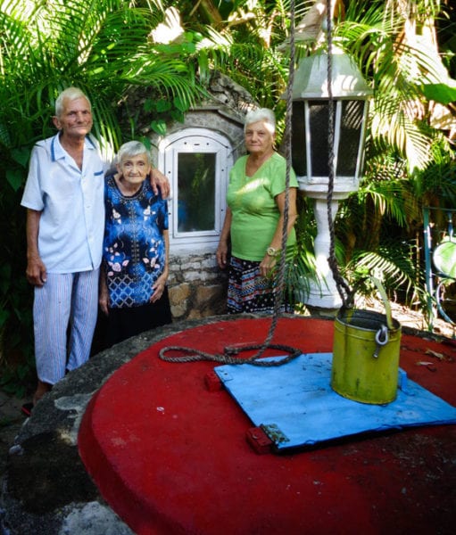 The family alongside the El Pocito well.